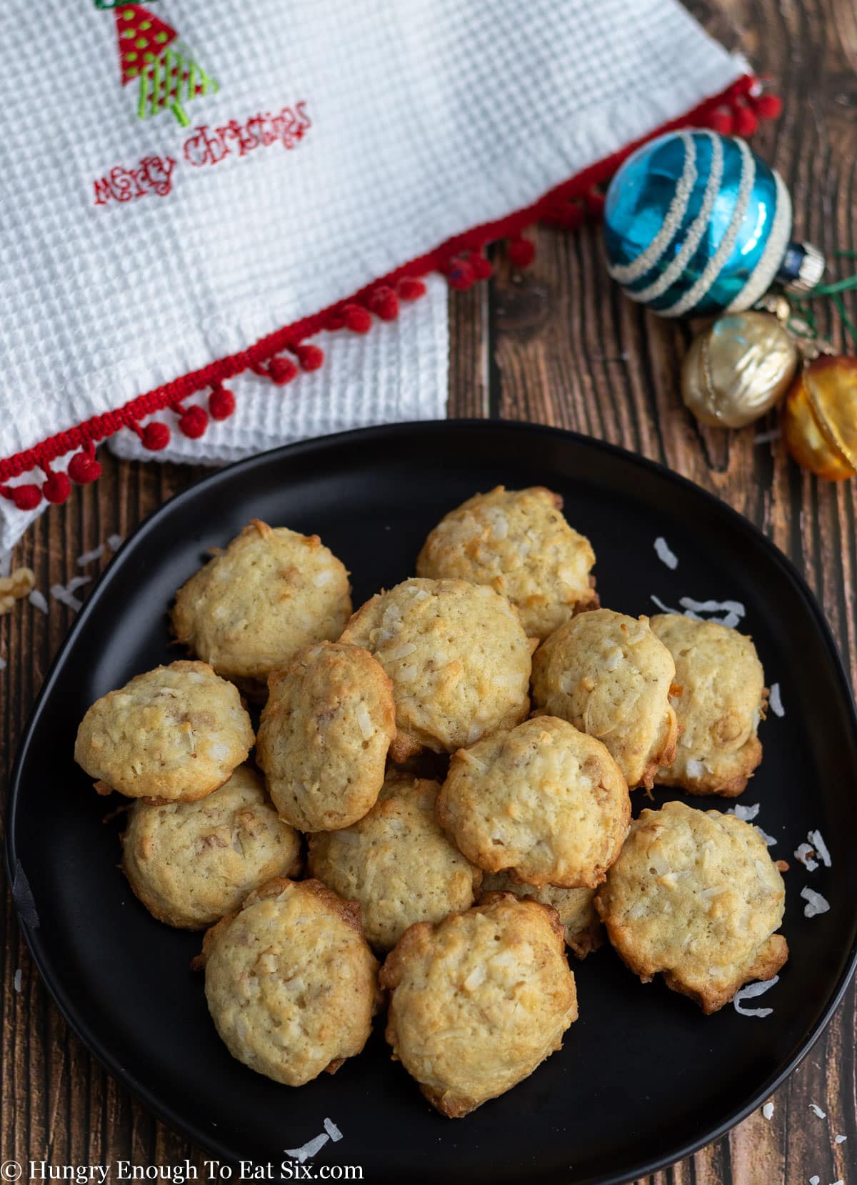 Black plate of small brown cookies