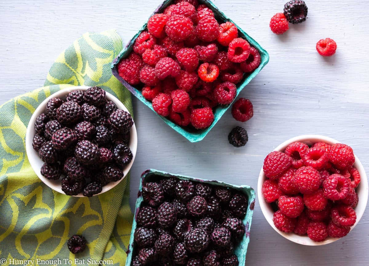 Red and black raspberries in baskets