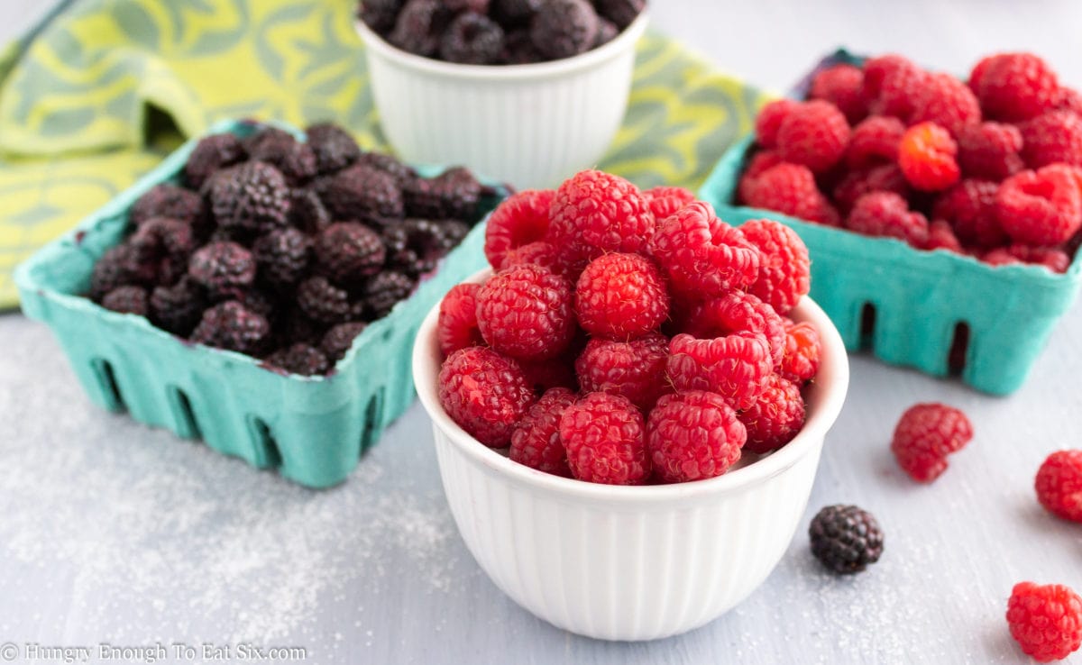 Raspberries and black raspberries in containers