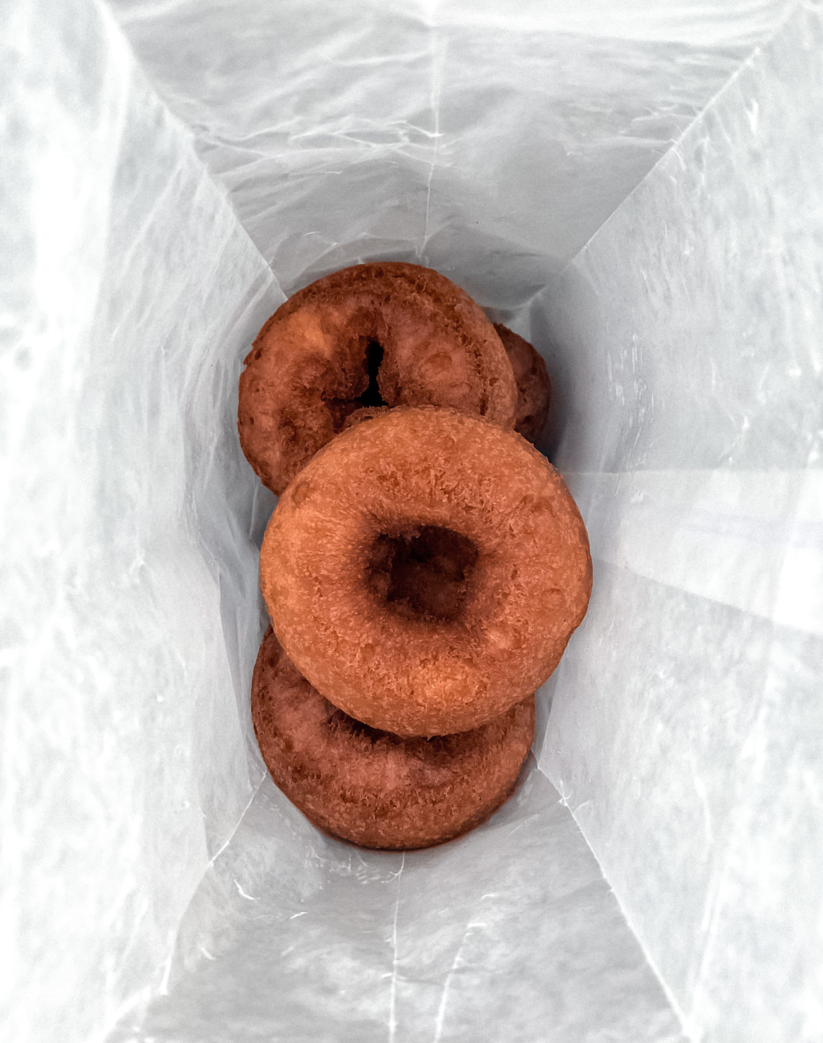 Uncoated doughnuts in bag
