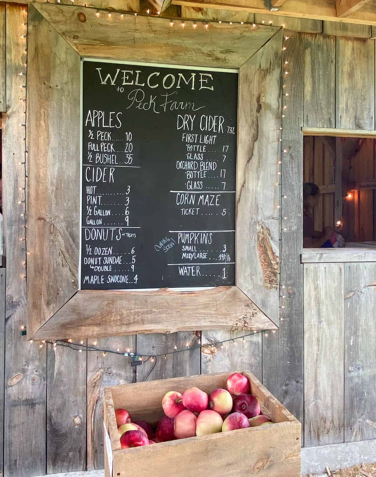 Chalk menu board on side of barn.