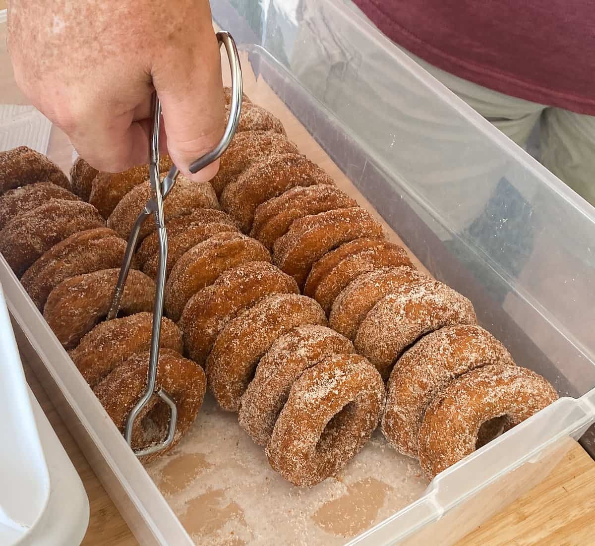 Rows if sugar-coated donuts in a box.