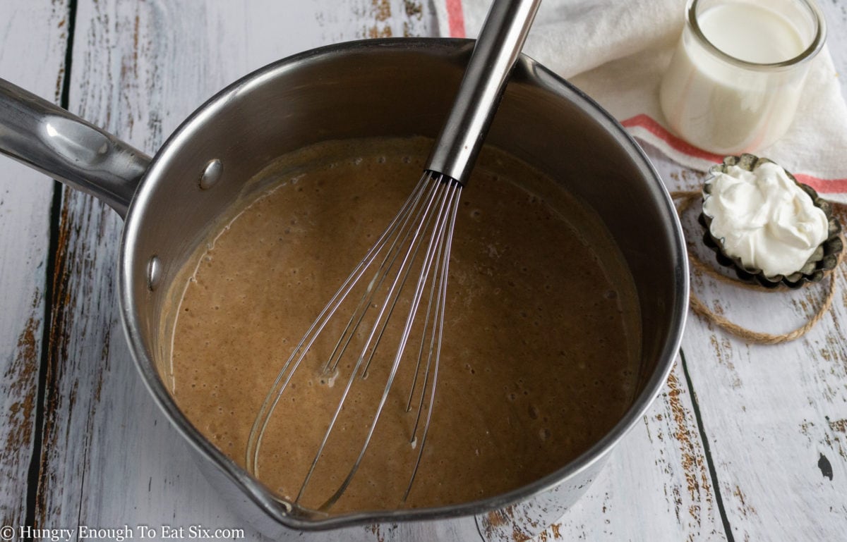 Cinnamon custard mixture in a saucepan
