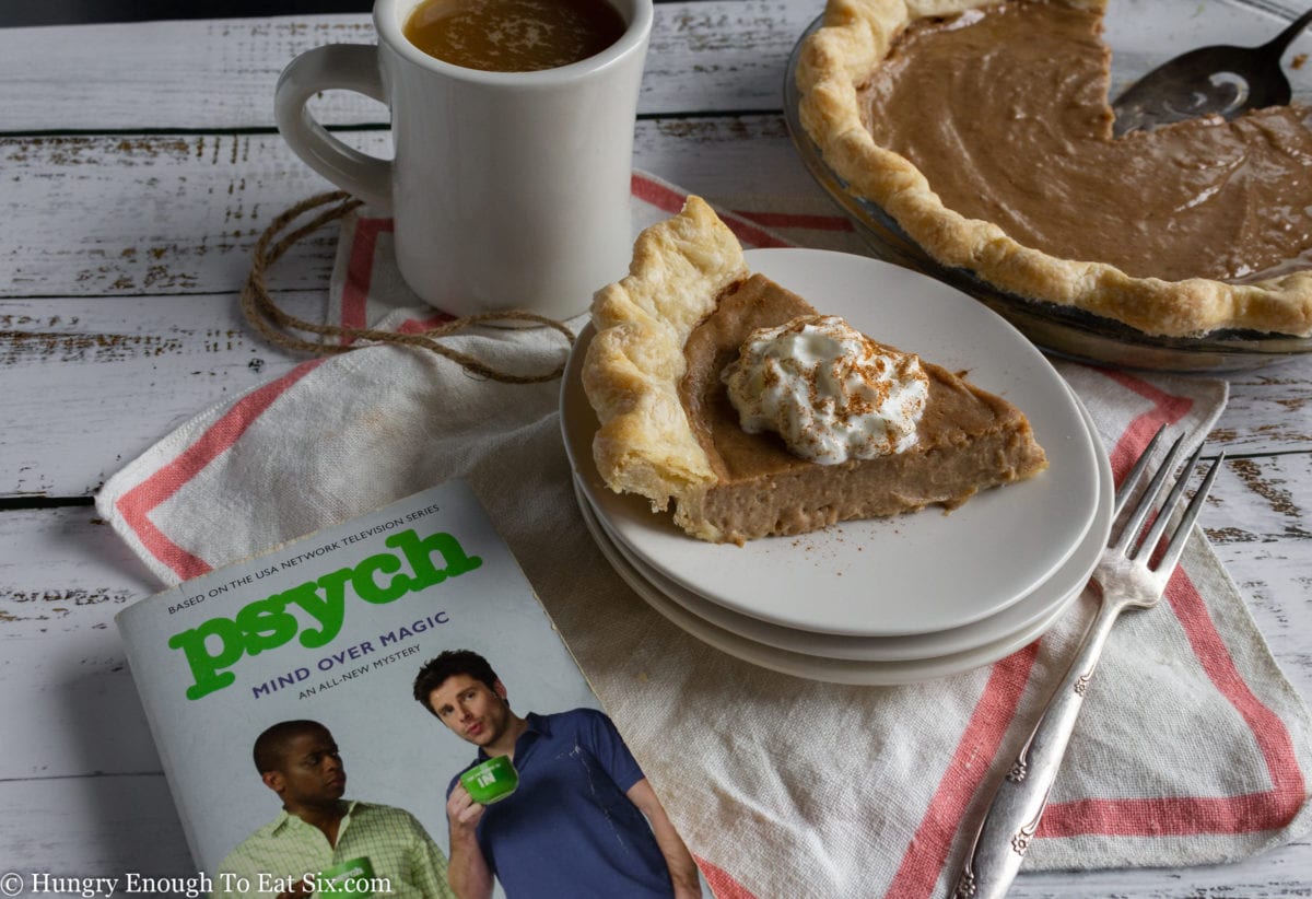 Slice of pie next to a "Psych" book