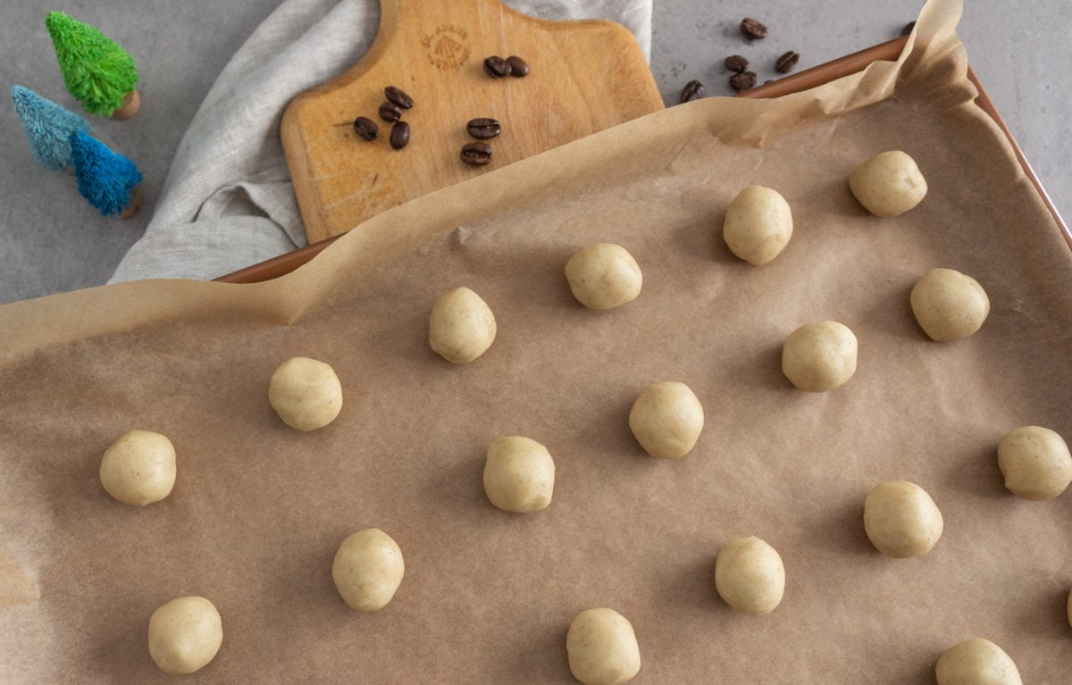Balls of cookie dough on baking sheet