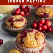 Muffin pan filled with berries and muffins