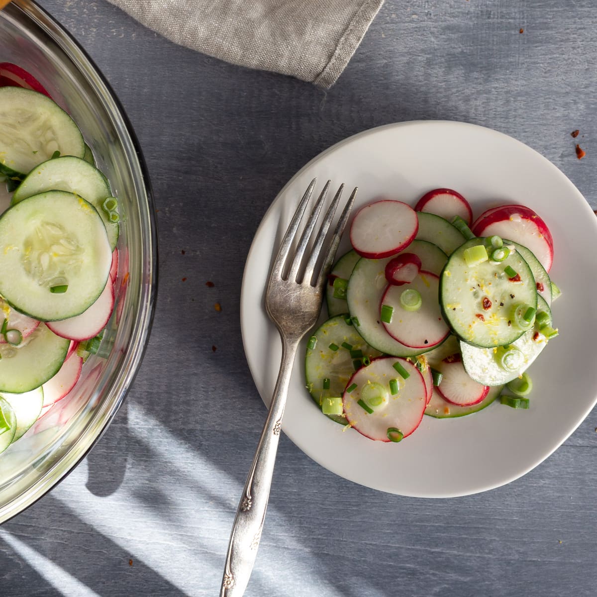 White plate with cucumber salad