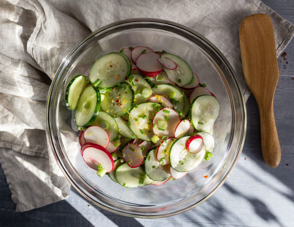 Large bowl of salad made with cucumbers
