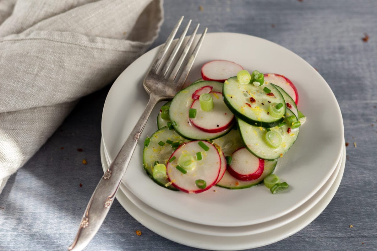 Plate with slices of radishes and cucumbers