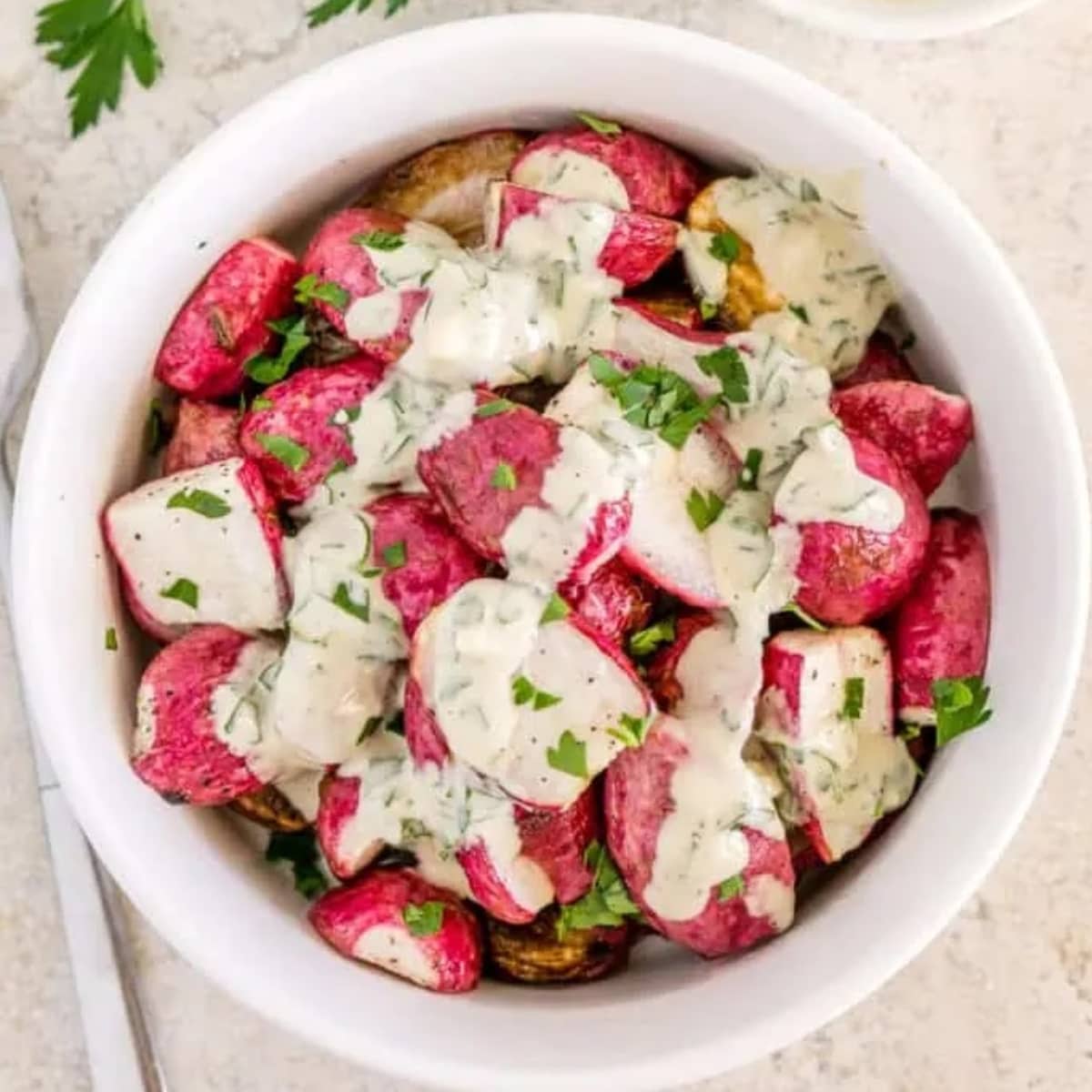 Bowl of roasted radish wedges