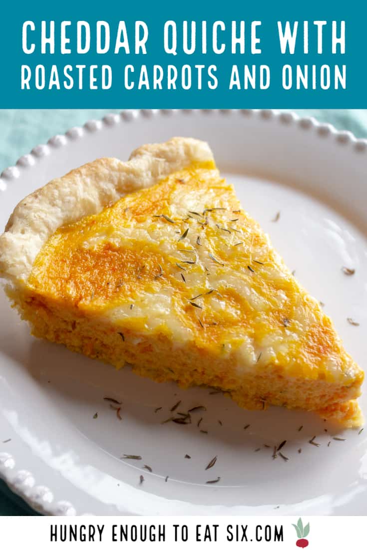 Slice of cheddar and carrot quiche on plate.