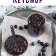 Blueberry ketchup in two small cups.