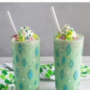 Two tall glasses with green milkshakes