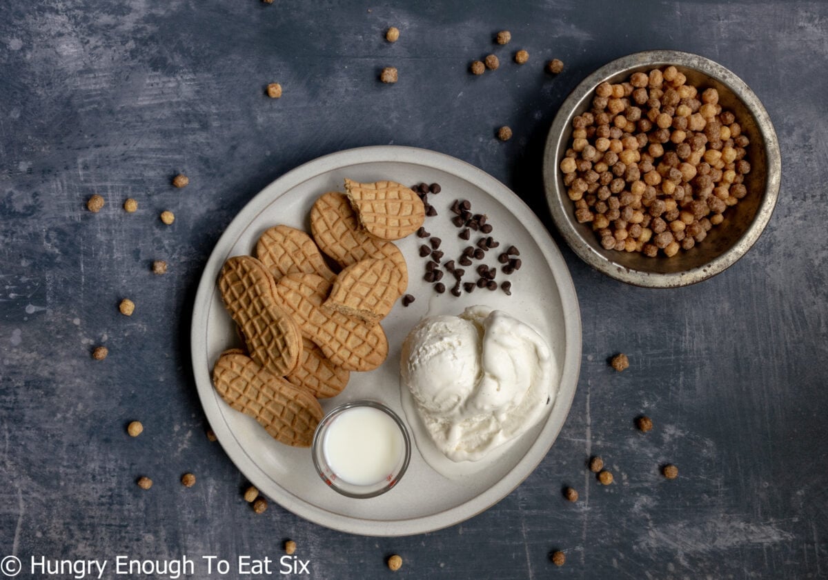 Plate with cookies, chocolate chips, ice cream, and cereal.