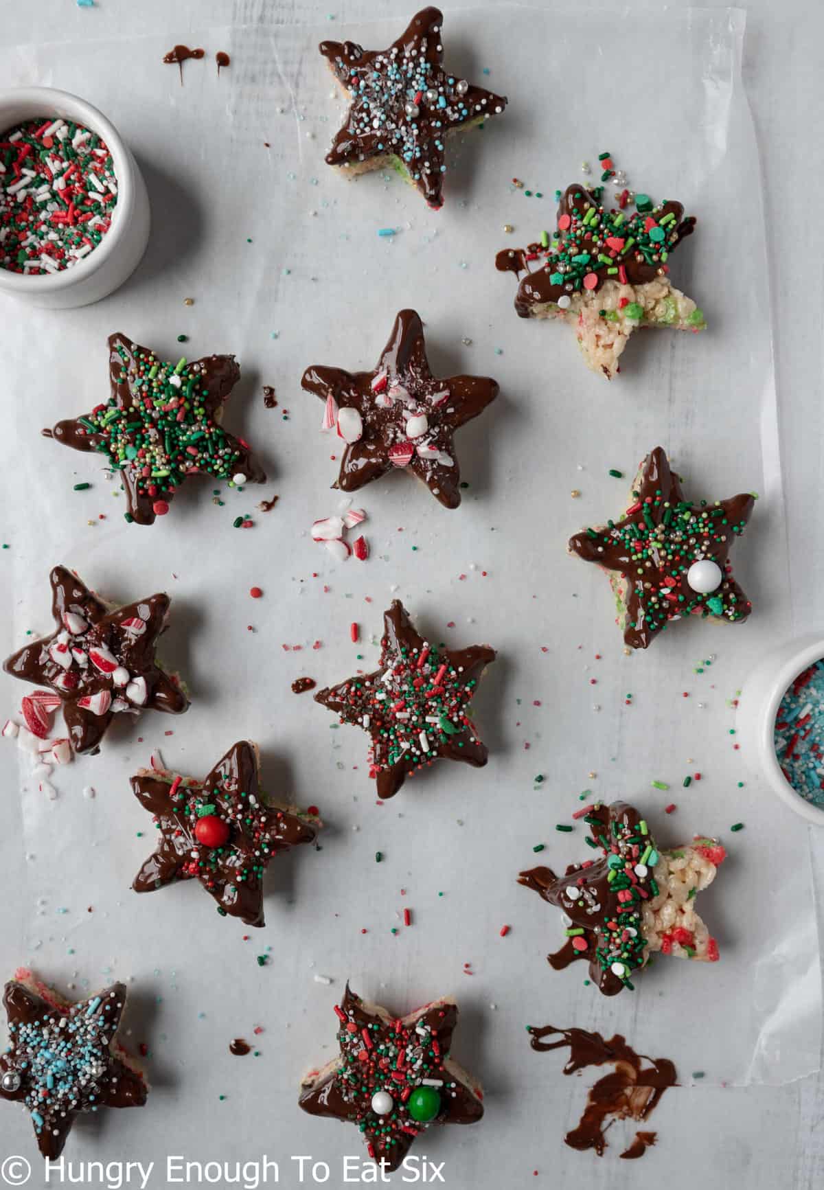Star marshmallow treats on wax paper with sprinkles.