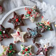 White plate with sprinkle covered star treats.