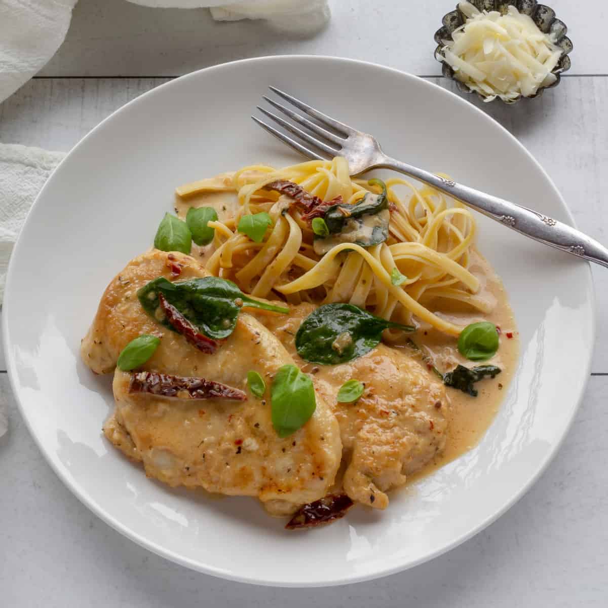 Chicken cutlets in a creamy spinach and tomato sauce.