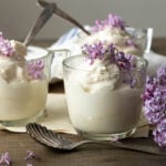 Small glass cups with ice cream and spoons.