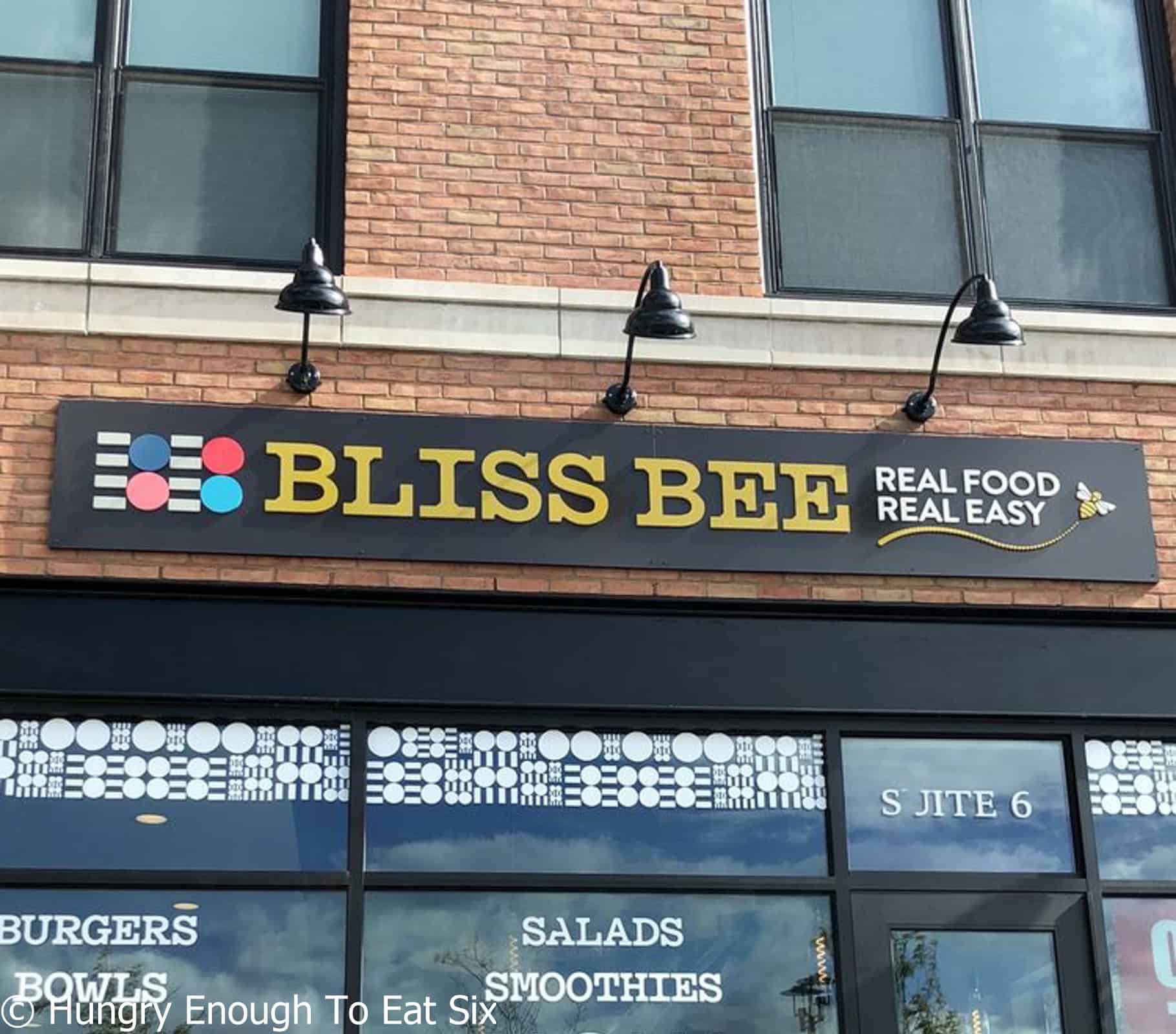 Building front with Bliss Bee written above windows