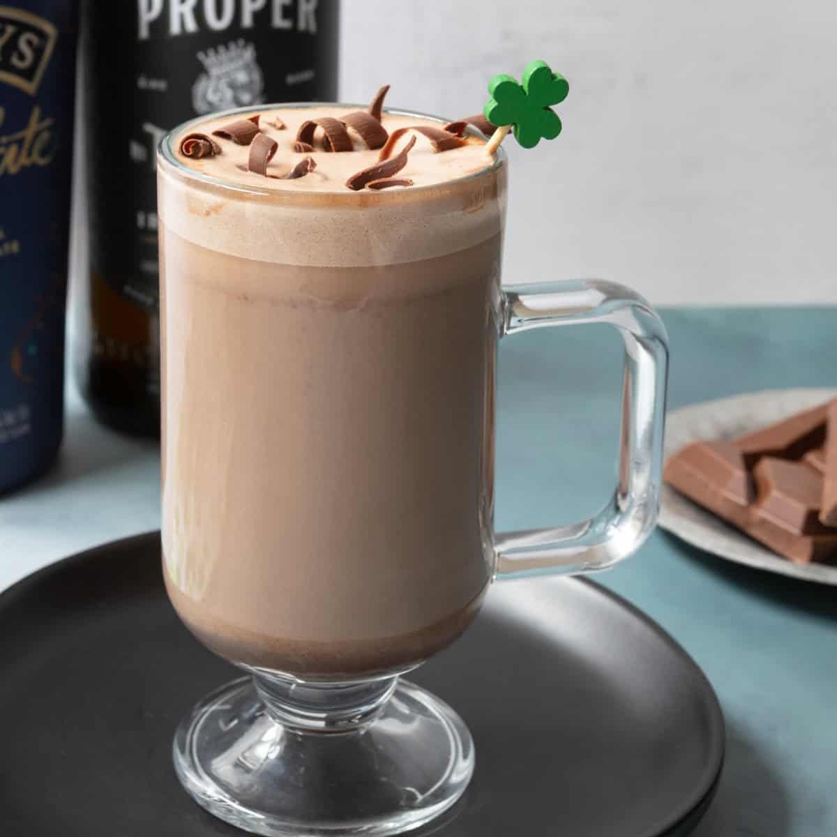 Chocolate Irish coffee drink in a clear glass.
