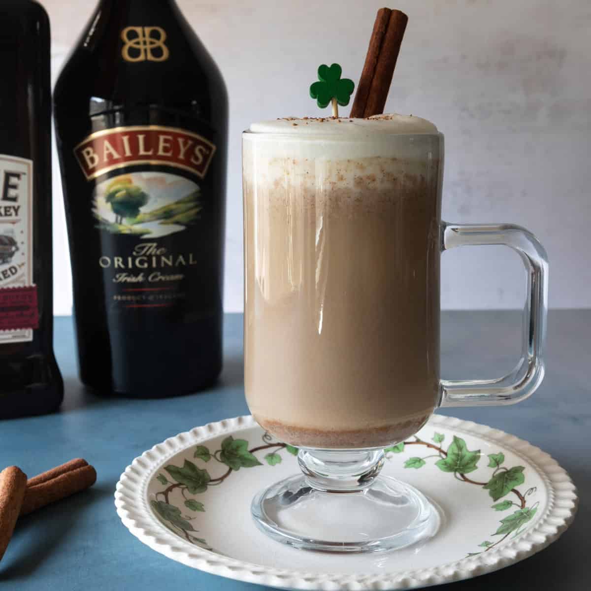 White plate with glass of Irish coffee.