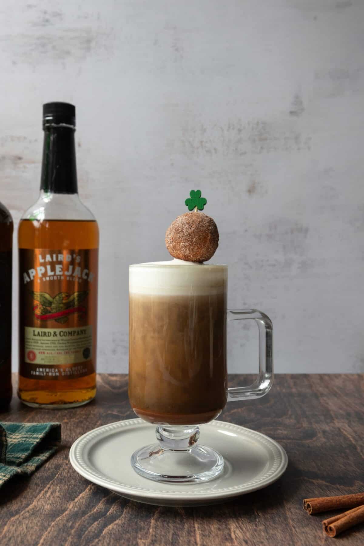 Apple cider donut Irish coffee topped with a mini donut.