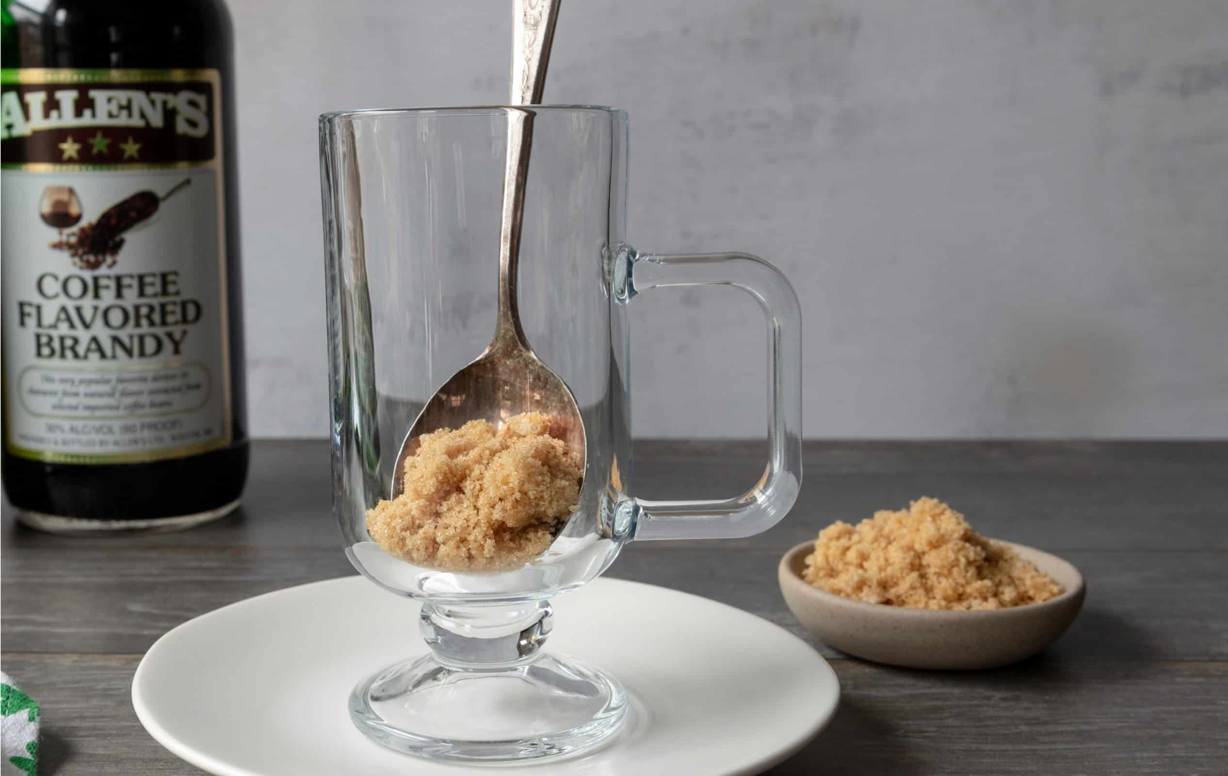 glass mug with brown sugar, for a coffee brandy Irish coffee.