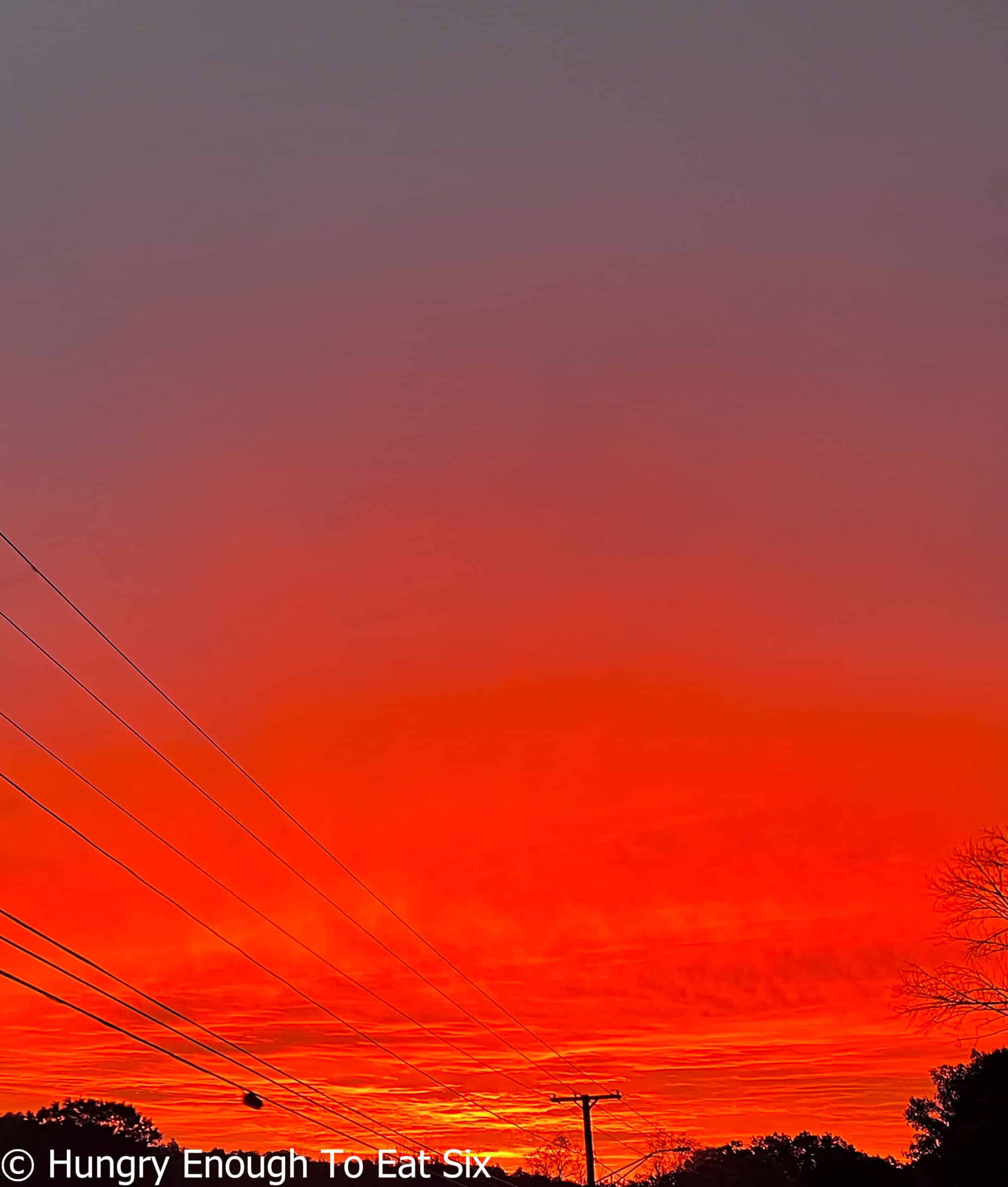 Morning sky filled with red light.