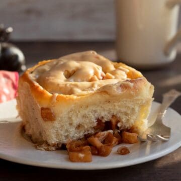 Cinnamon roll and diced apples in the sunshine.