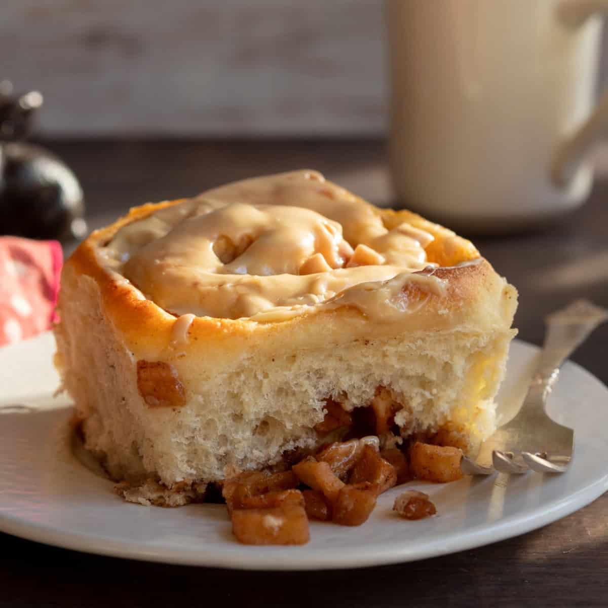 Cinnamon roll and diced apples in the sunshine.