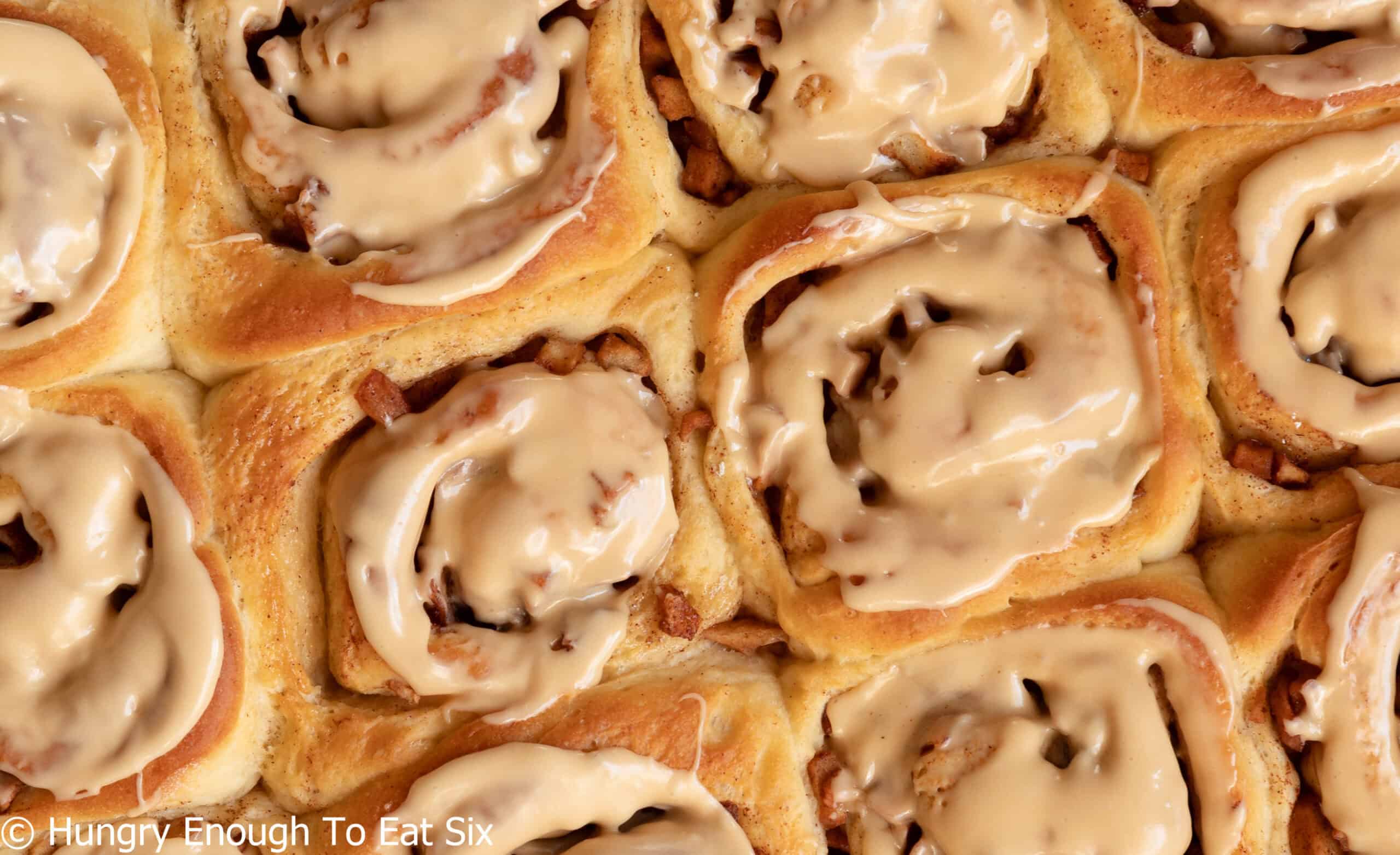 Several frosted cinnamon rolls.