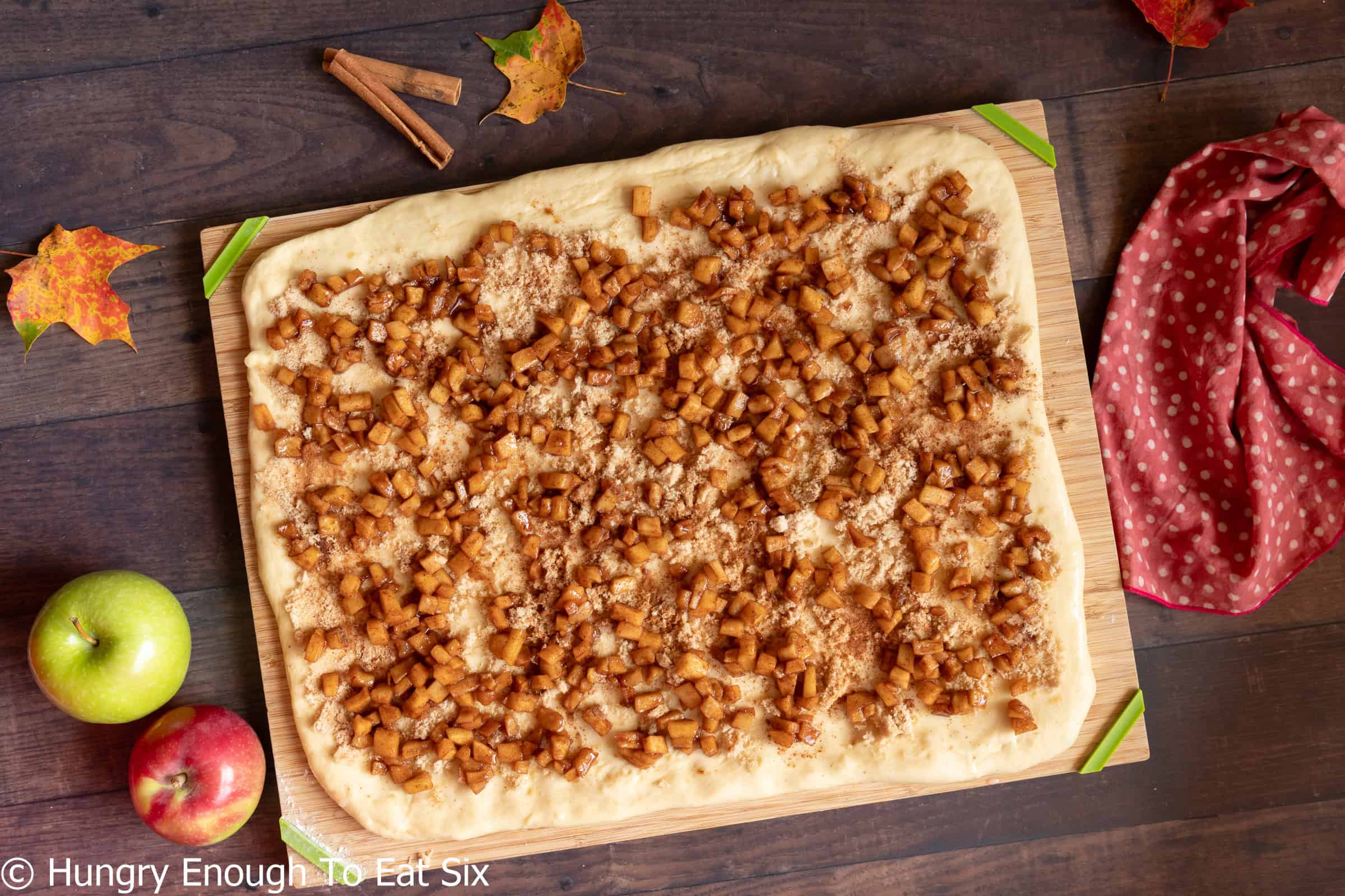 Diced apples spread over rectangle of dough.