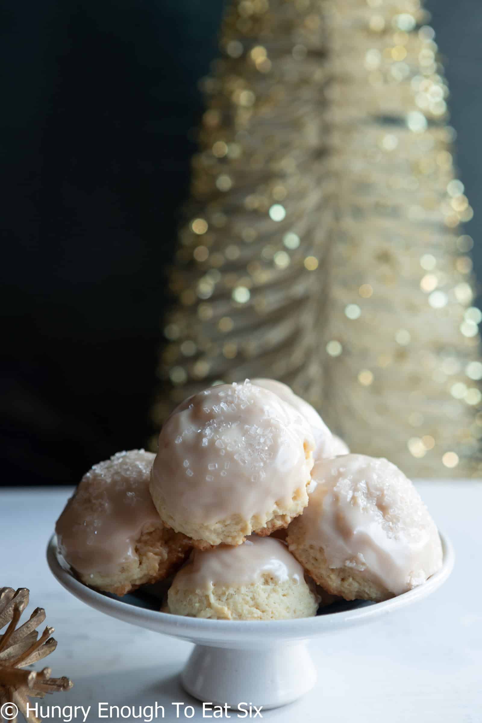 Small plate stand with pile of Vanilla Cozy-Ups sour cream sugar cookies.