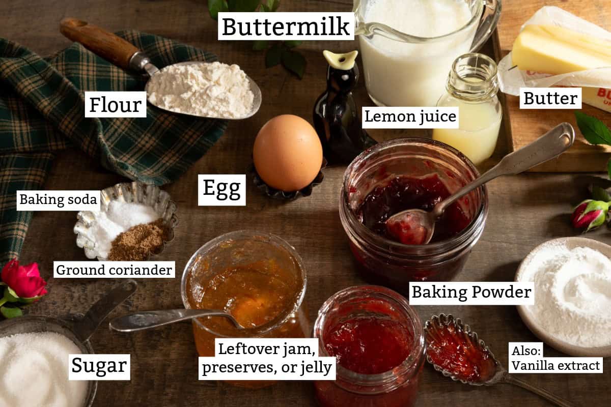 Ingredients for buttermilk scones: jam, egg, flour, sugar, baking powder and soda, coriander, buttermilk, butter.