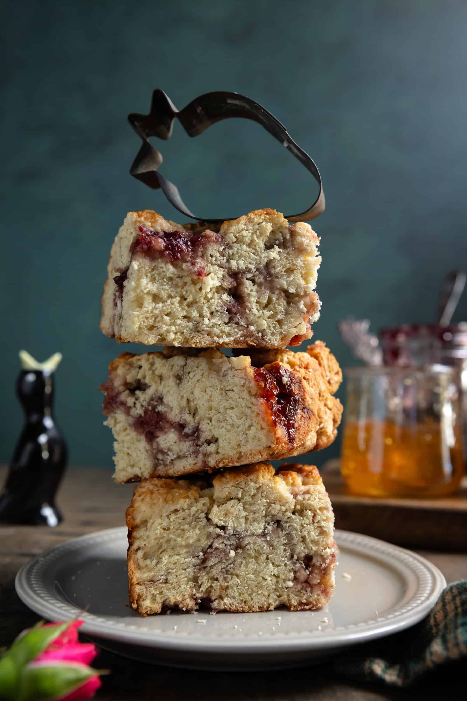 Tower of three jam swirled buttermilk scones.