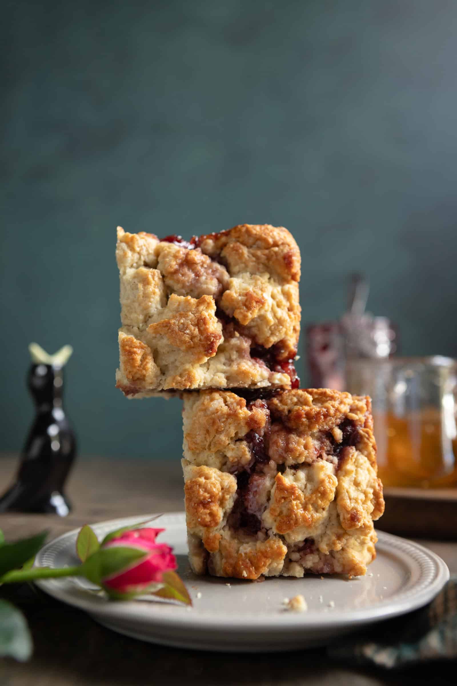 Two square buttermilk scones stacked on one another.