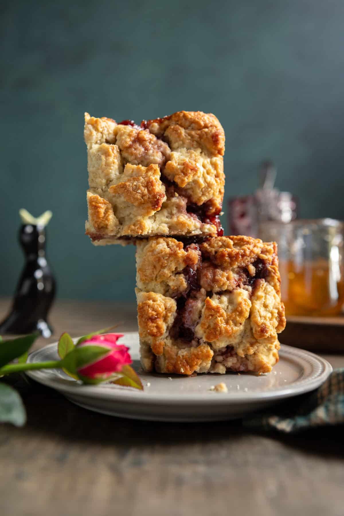 Buttermilk scone squares stacked on a plate.