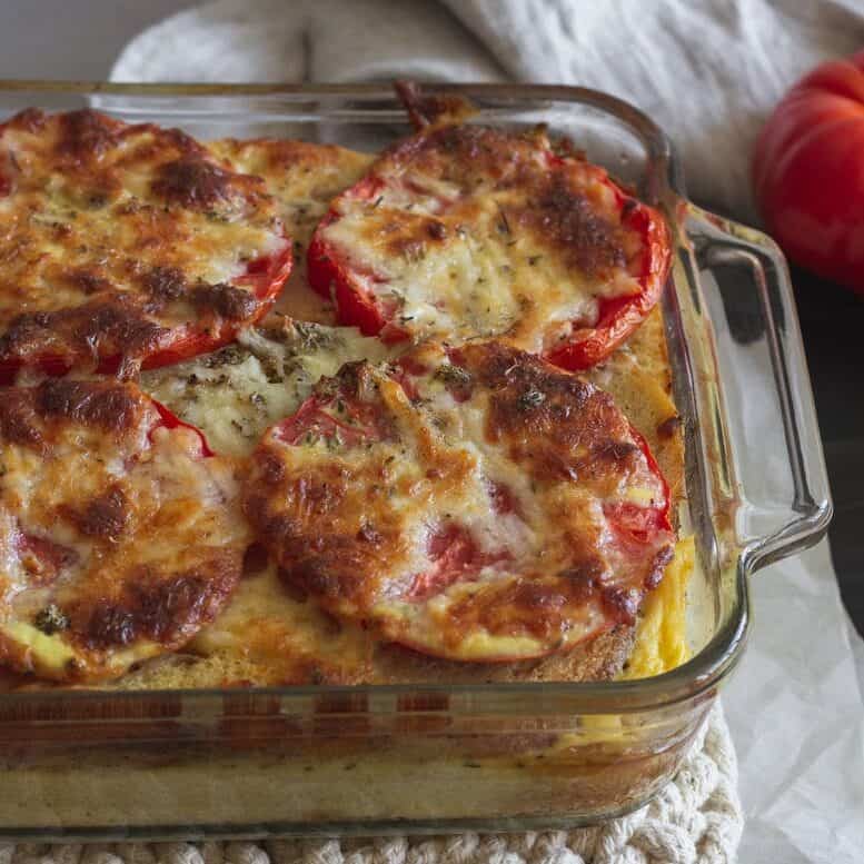 Browned cheese over tomatoes and egg bake