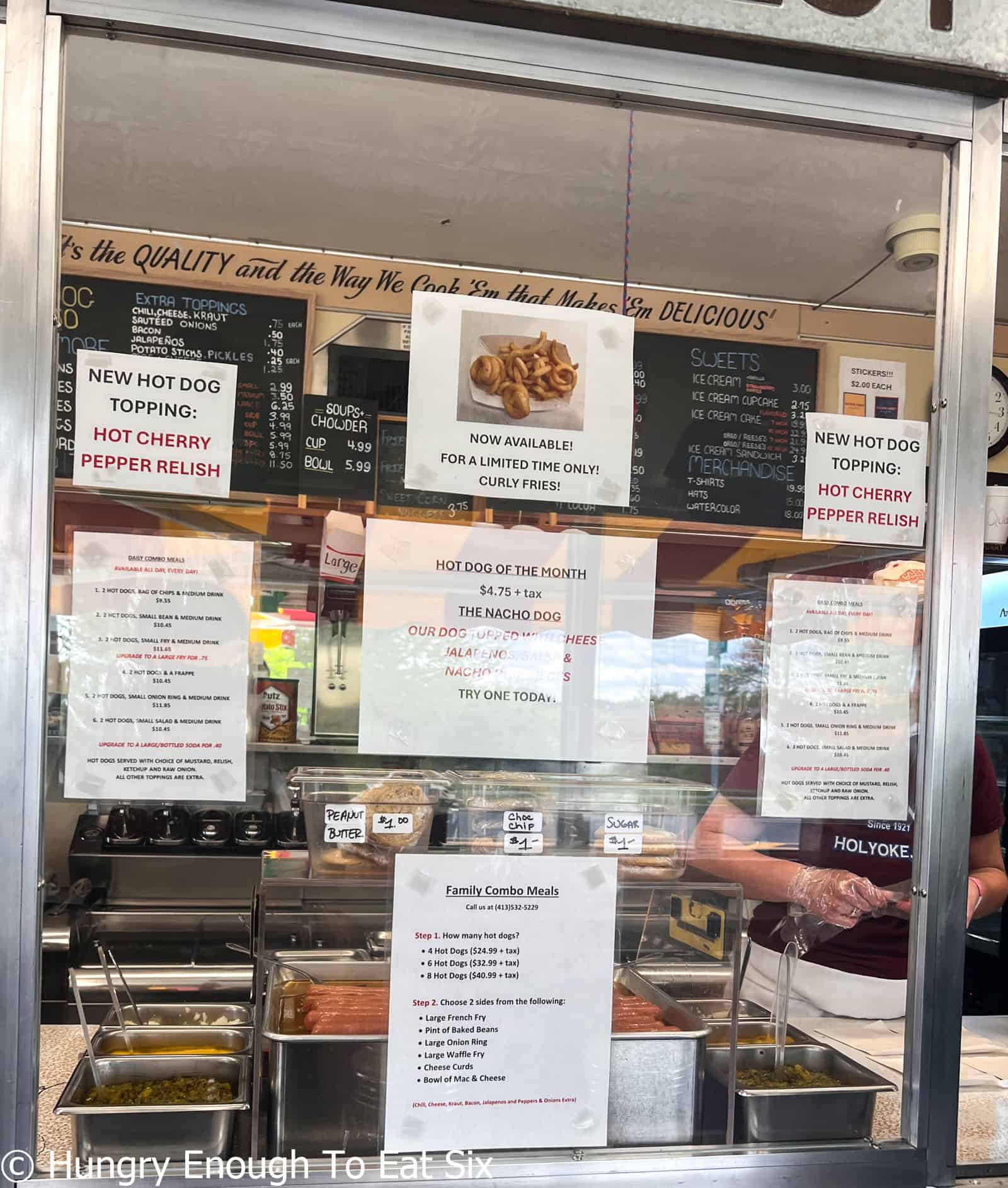 Signs and menu at Nick's nest, a central MA hot dog spot.