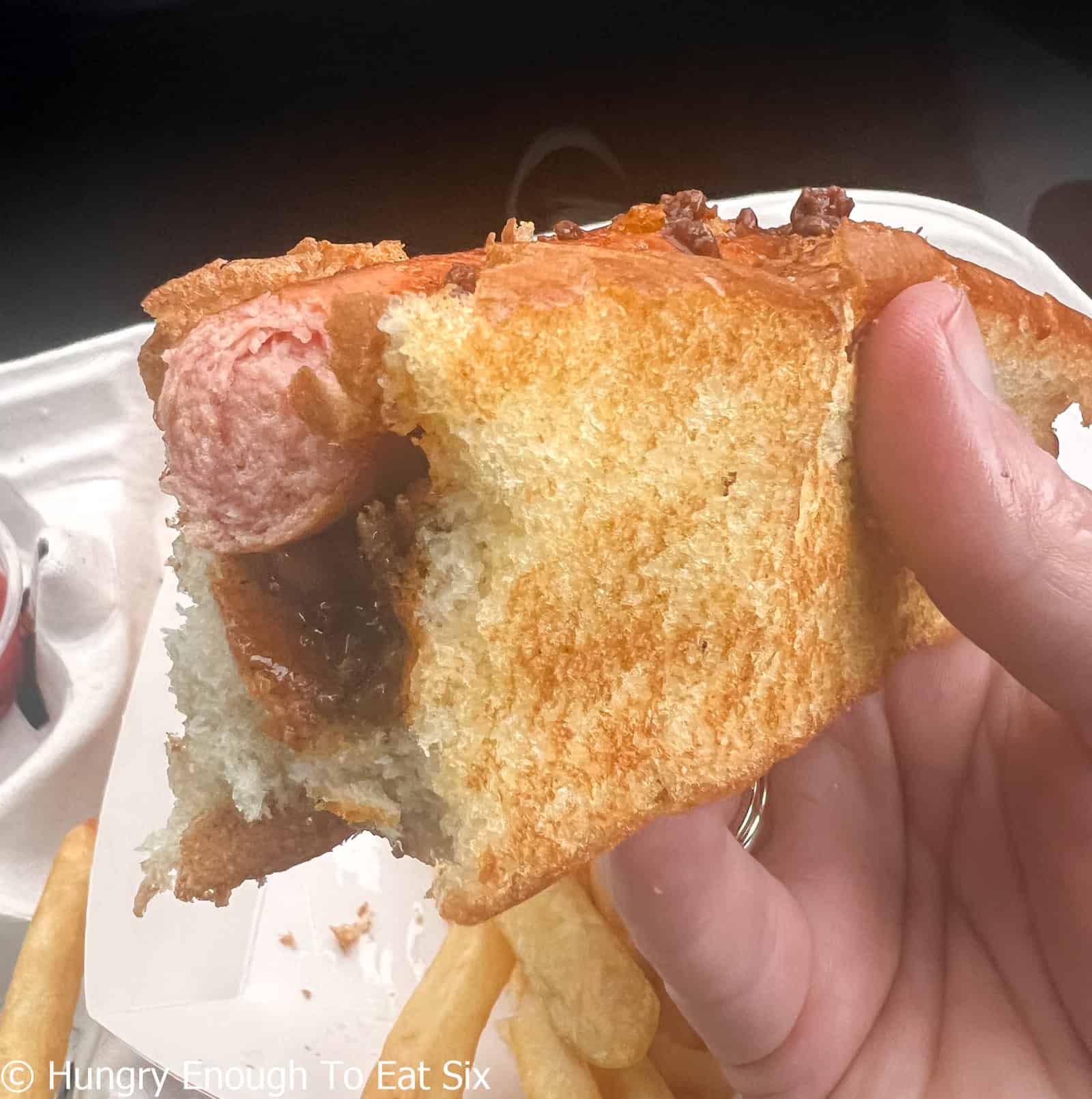 Half eaten hot dog from Lee's, a central MA hot dog stand.