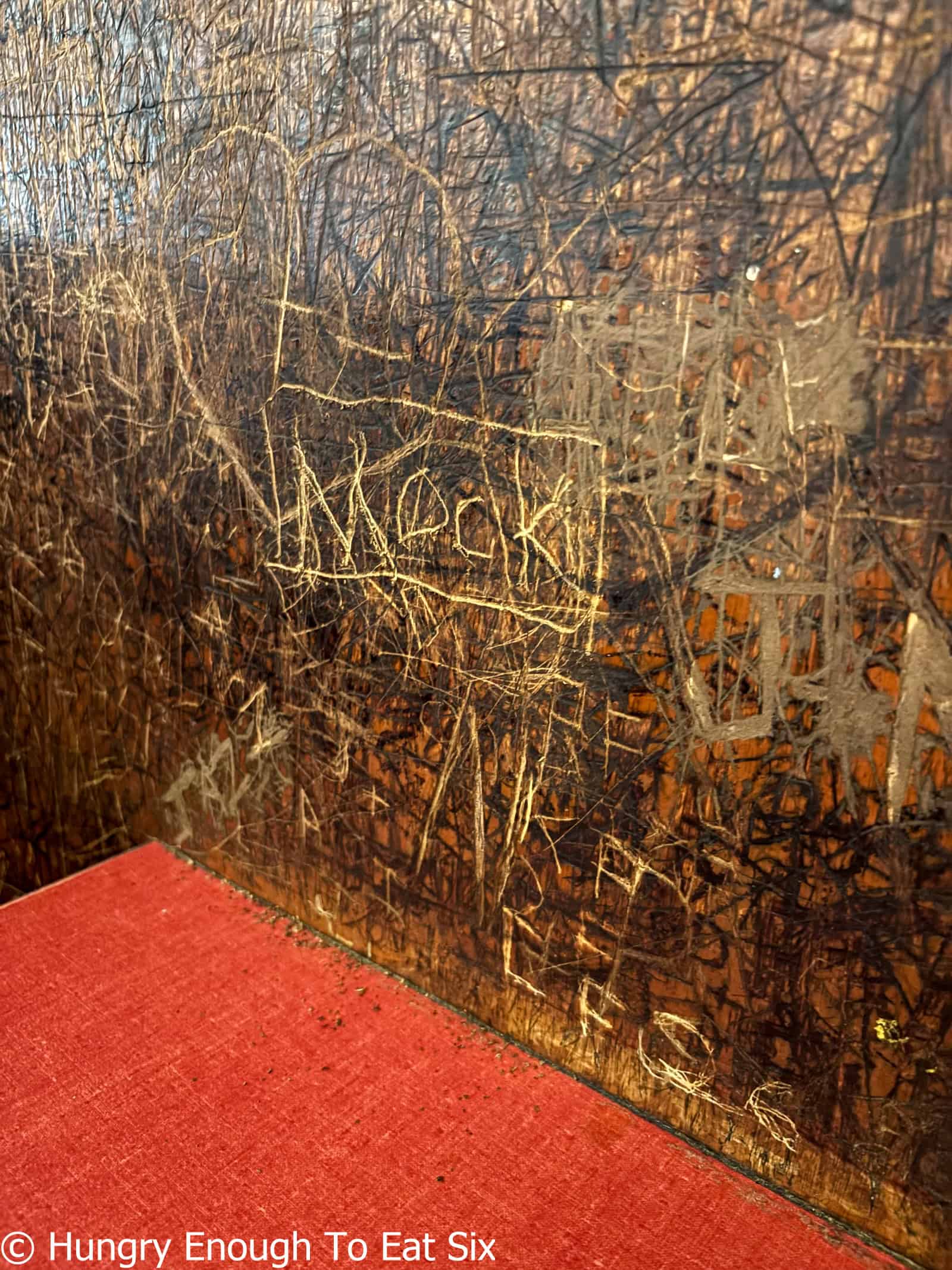 Carvings on a booth at Georges Coney Island, a central MA hot dog joint.