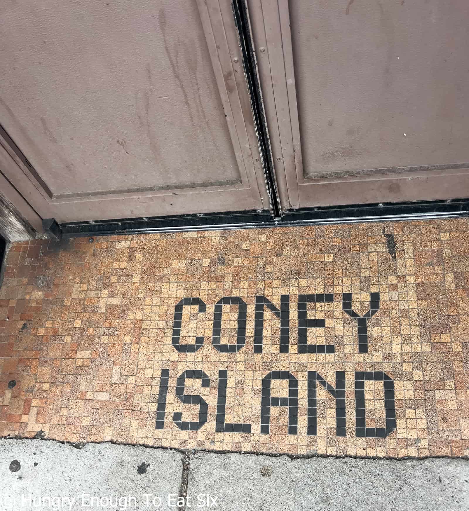 Tile spelling Coney Island, at a Central Massachusetts hot dog stand.